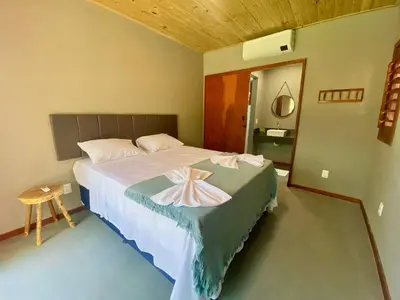 Uma cama ou camas num quarto em Casa do Pier, bangalôs em Fortim c/ Café da Manhã