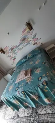 Uma cama ou camas num quarto em Aloha pousada & restaurante