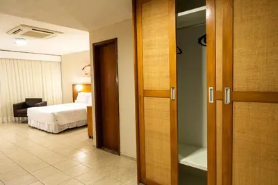 Uma cama ou camas num quarto em Hotel Praia Centro