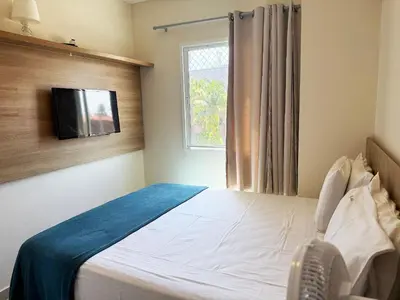 Uma cama ou camas num quarto em Hosts BR - Apartamentos no VG Fun Praia do Futuro Vista Mar