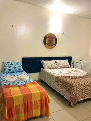 Uma cama ou camas num quarto em Pousada Vila do Pôr do Sol Canoa Quebrada