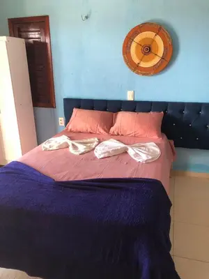 Uma cama ou camas num quarto em Pousada Vila do Pôr do Sol Canoa Quebrada