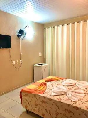 Uma cama ou camas num quarto em Pousada Vila do Pôr do Sol Canoa Quebrada