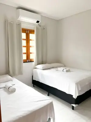 Uma cama ou camas num quarto em Casa na Praia do Preá, com Piscina