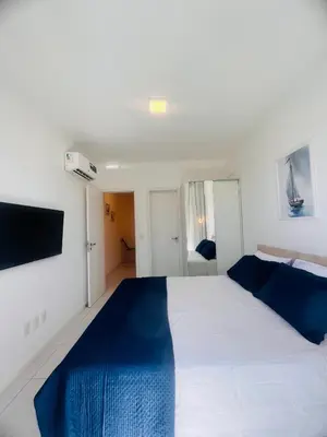 Uma cama ou camas num quarto em Cobertura Palm Beach Porto das Dunas