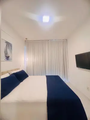Uma cama ou camas num quarto em Cobertura Palm Beach Porto das Dunas