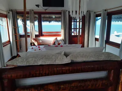 Uma cama ou camas num quarto em Pousada TERRA NOVA
