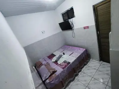 Uma cama ou camas num quarto em Pousada Terra do Sol