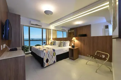Uma cama ou camas num quarto em Hotel Beira Mar