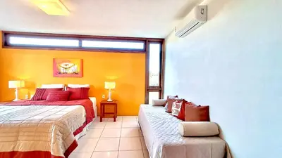 Uma cama ou camas num quarto em Villa Caju Knots