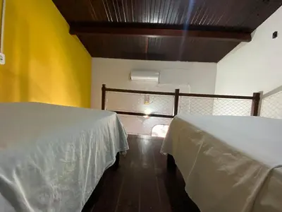Uma cama ou camas num quarto em Pousada Tropicalia