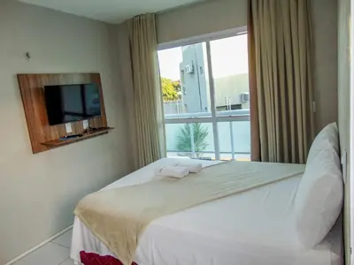 Uma cama ou camas num quarto em Terraço Hotel Lagoinha