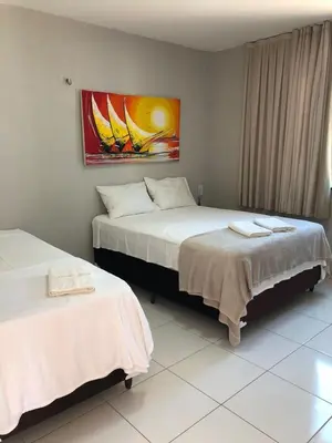Uma cama ou camas num quarto em Terraço Hotel Lagoinha
