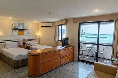 Uma cama ou camas num quarto em Flat no melhor da Beira-mar de Fortaleza