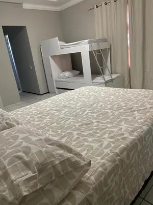 Uma cama ou camas num quarto em apartamento mobiliado praia do futuro 200m da praia