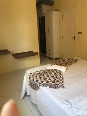 Uma cama ou camas num quarto em Cris hospedagem