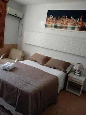 Uma cama ou camas num quarto em Pousada Areia da Praia