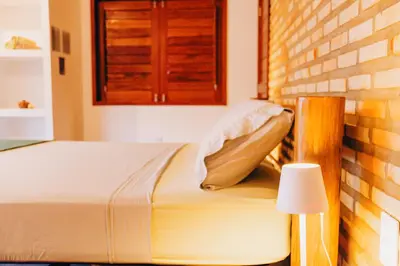 Uma cama ou camas num quarto em Casa de Coco Icarai