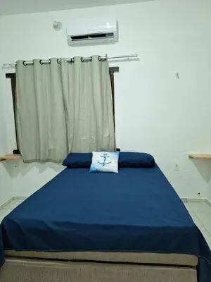 Uma cama ou camas num quarto em Mar Azul Casa de Praia