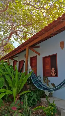 Um jardim no exterior de Recanto do cajueiro