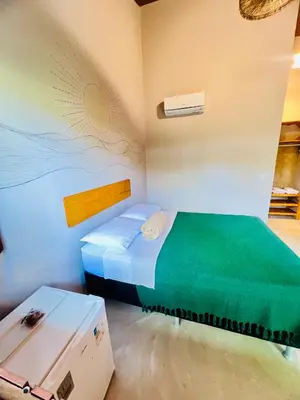 Uma cama ou camas num quarto em Recanto do cajueiro