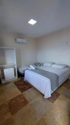 Uma cama ou camas num quarto em Chico Caranguejo da Baleia