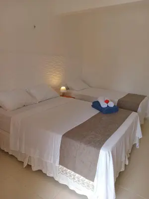 Uma cama ou camas num quarto em Jardim das Dunas