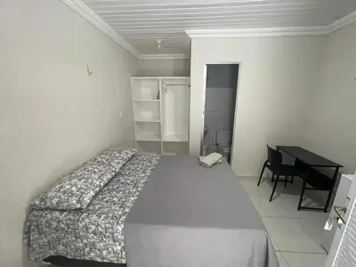 Uma cama ou camas num quarto em Villa Beira Mar Suítes