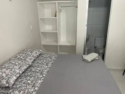 Uma cama ou camas num quarto em Villa Beira Mar Suítes