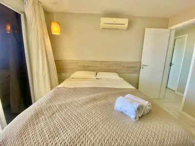 Uma cama ou camas num quarto em Condomínio Portal das Dunas