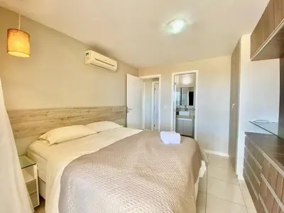 Uma cama ou camas num quarto em Condomínio Portal das Dunas