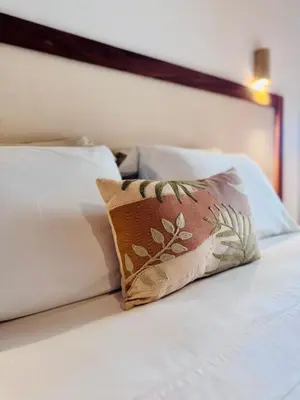 Uma cama ou camas num quarto em Casa Calango suites