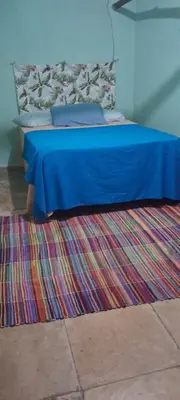Uma cama ou camas num quarto em Vistamar Arco das Flores 2