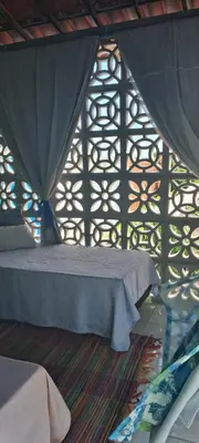 Uma cama ou camas num quarto em Vistamar Arco das Flores 2