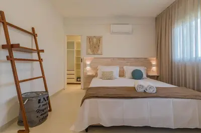 Uma cama ou camas num quarto em Kite Star - Apartamento com varanda por Carpediem