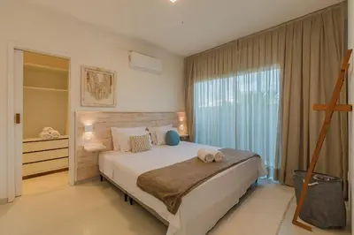Uma cama ou camas num quarto em Kite Star - Térreo duplo por Carpediem