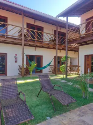 Um jardim no exterior de Pousada Quinta do Mar