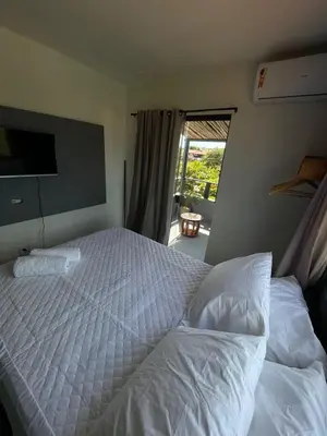 Uma cama ou camas num quarto em Casa brisa do serrote