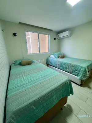 Uma cama ou camas num quarto em Paraíso Beach - Terramaris - Apartamento frente mar, pé na areia, próximo ao Beach Park