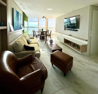 Uma televisão e/ou sistema de entretenimento em Paraíso Beach - Terramaris - Apartamento frente mar, pé na areia, próximo ao Beach Park