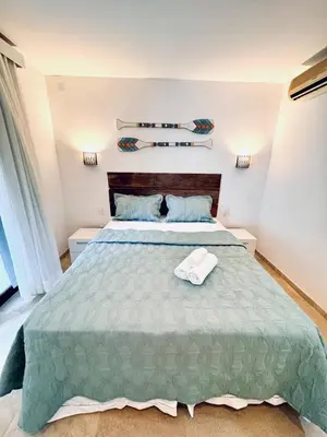 Uma cama ou camas num quarto em CASA TAÍBA BEACH RESORT PÉ Na AREIA - IMOB TEMPORADA