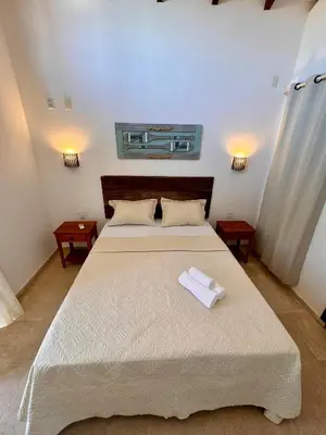 Uma cama ou camas num quarto em CASA TAÍBA BEACH RESORT PÉ Na AREIA - IMOB TEMPORADA