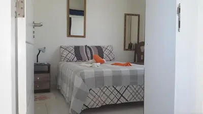 Uma cama ou camas num quarto em Apartamento 150m da praia de Canoa Quebrada