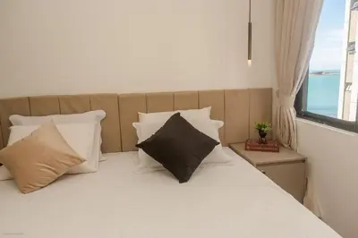 Uma cama ou camas num quarto em Flat Moderno e Elegante na Beira Mar de Fortaleza