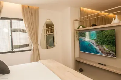 Uma televisão e/ou sistema de entretenimento em Flat Moderno e Elegante na Beira Mar de Fortaleza