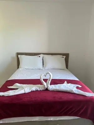 Uma cama ou camas num quarto em Pousada Lagoa Azul