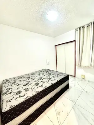 Uma cama ou camas num quarto em Flat Atlântico 405