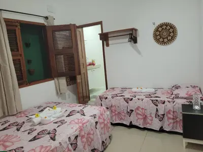Uma cama ou camas num quarto em Casa Sophis Hospedaria Praia do Preá