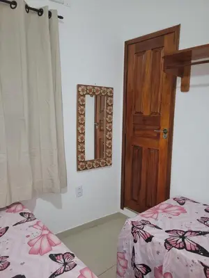 Uma cama ou camas num quarto em Casa Sophis Hospedaria Praia do Preá