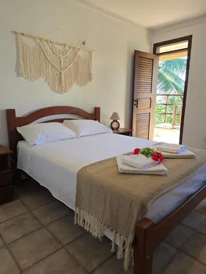 Uma cama ou camas num quarto em Kite and Dreaming Hotel